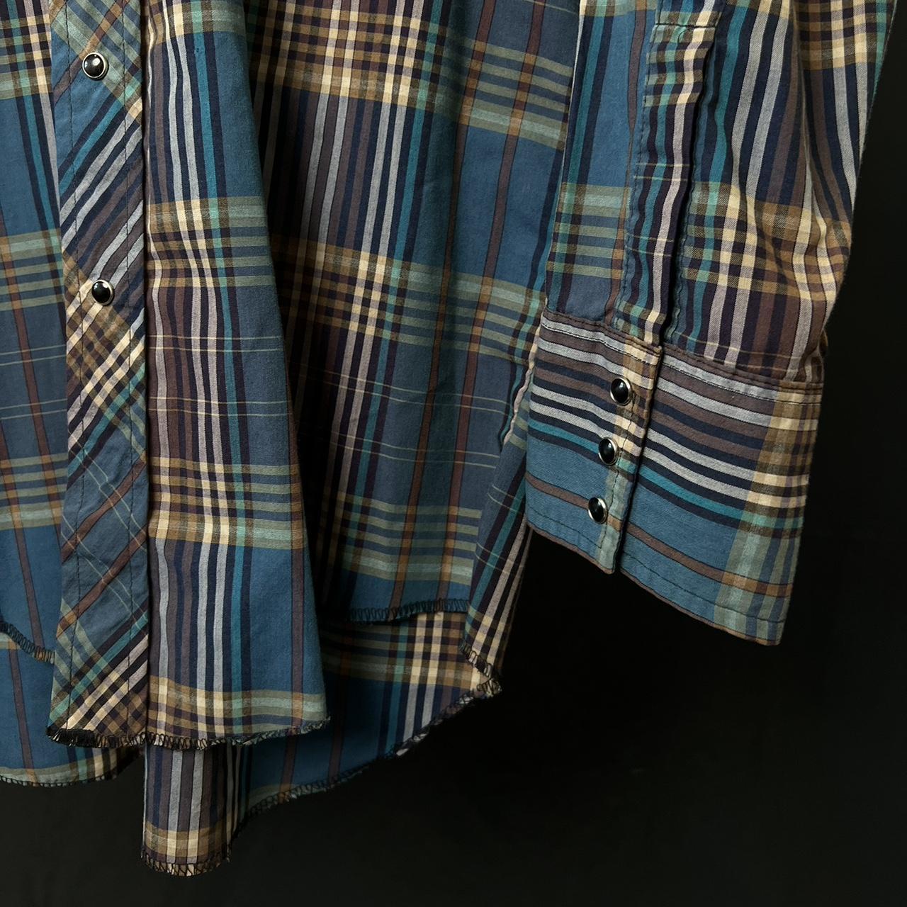 Blue and brown plaid Pearl snap shirt with a western vibe western wear