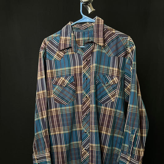 Blue and brown plaid Pearl snap shirt with a western vibe western wear